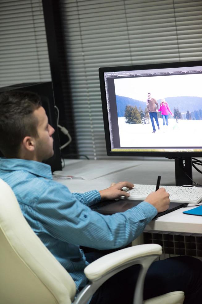 photo editor at his desk