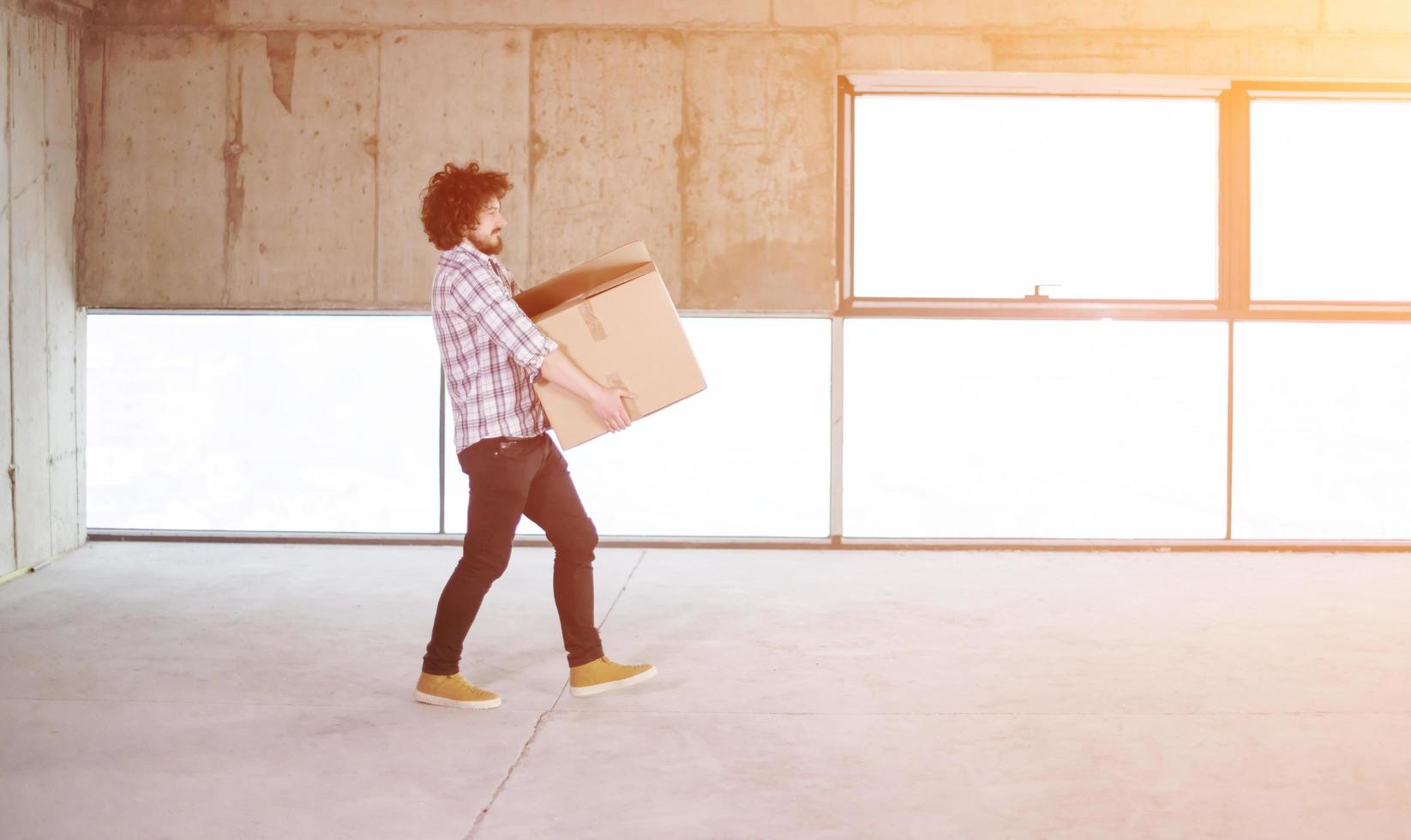 business man carrying cardboard box photo