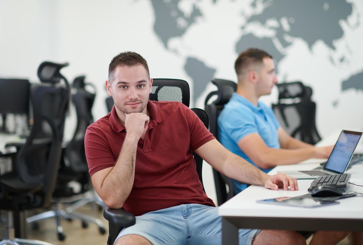 two male software developers working on computer photo