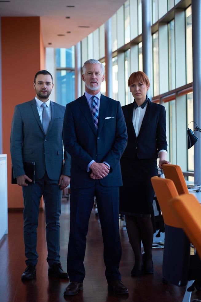 senior business man with his team at office photo