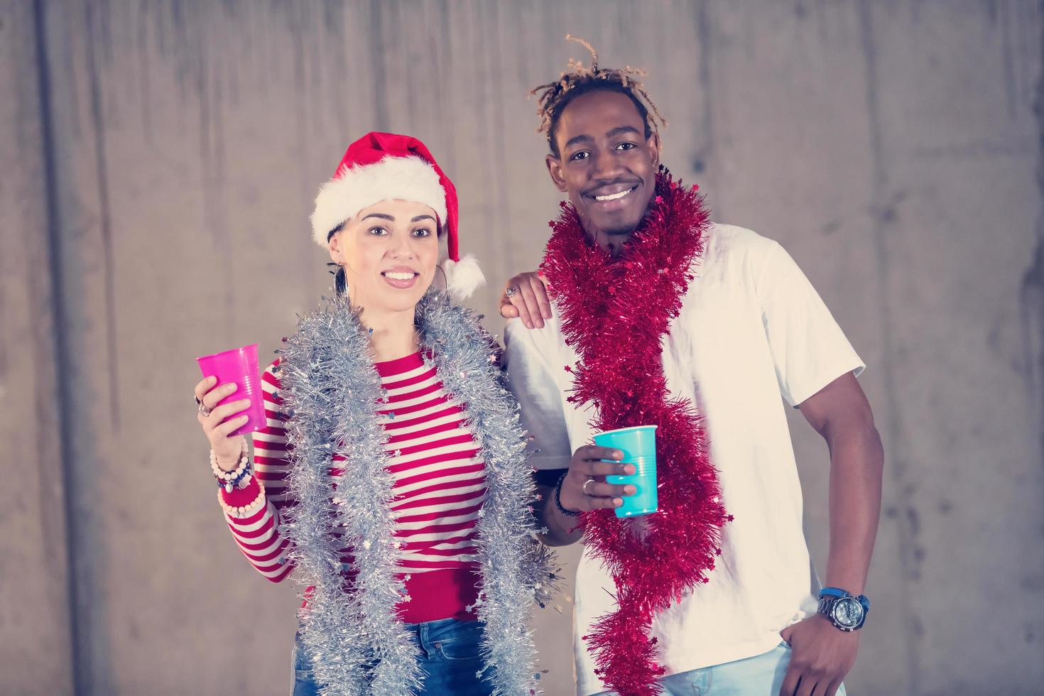 young multiethnic business couple celebrating new year party photo