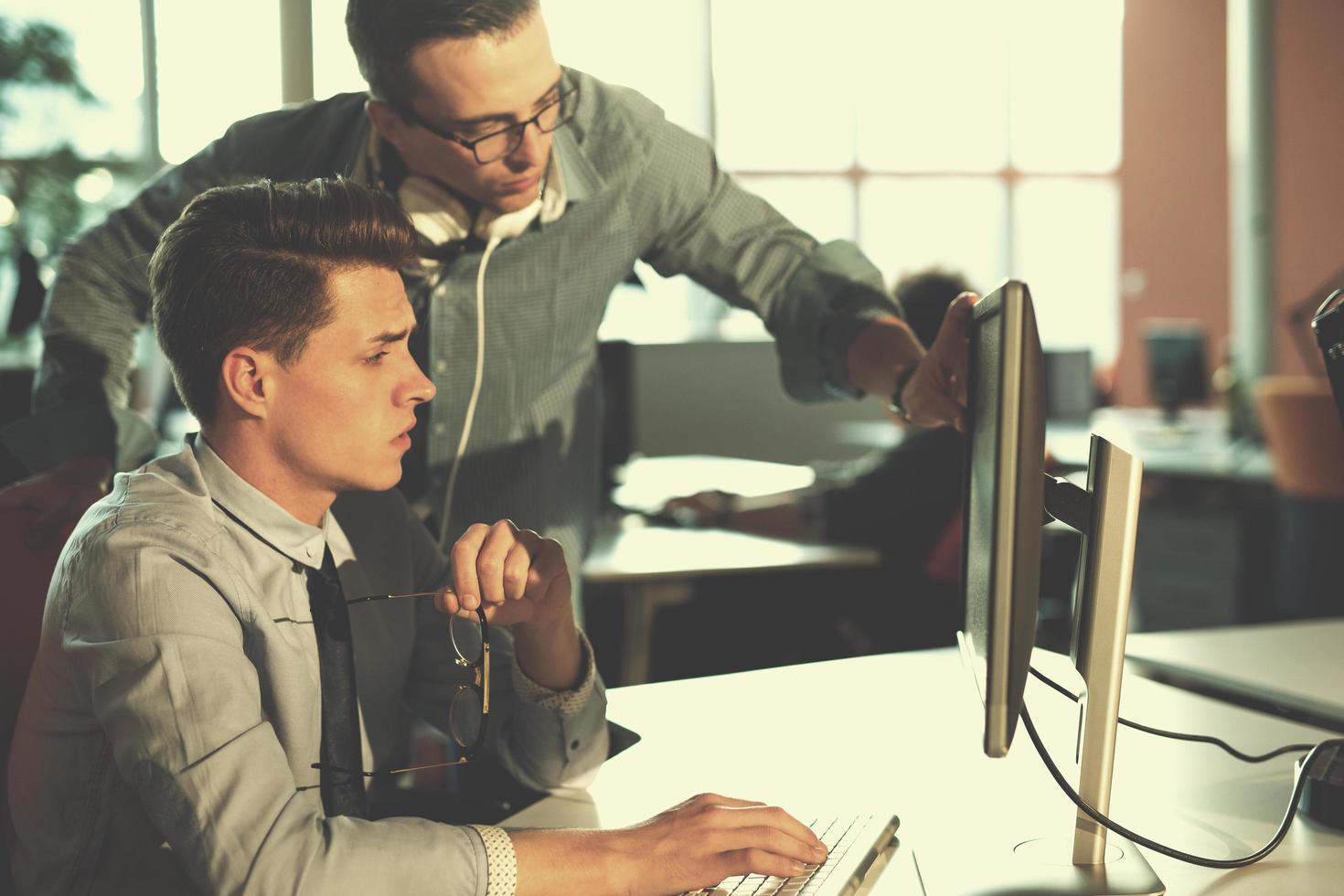 Two Business People Working With computer in office photo