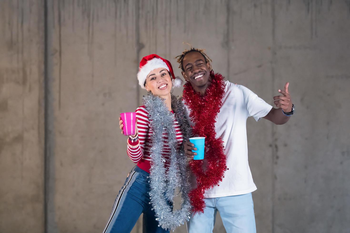 young multiethnic business couple celebrating new year party photo