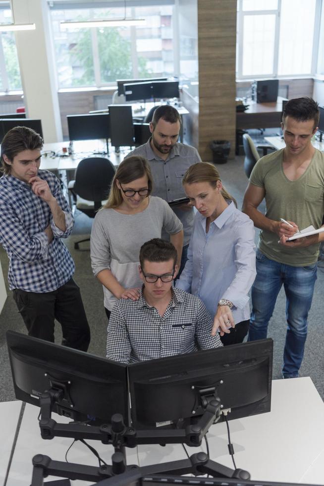 startup business people group working as team to find solution photo