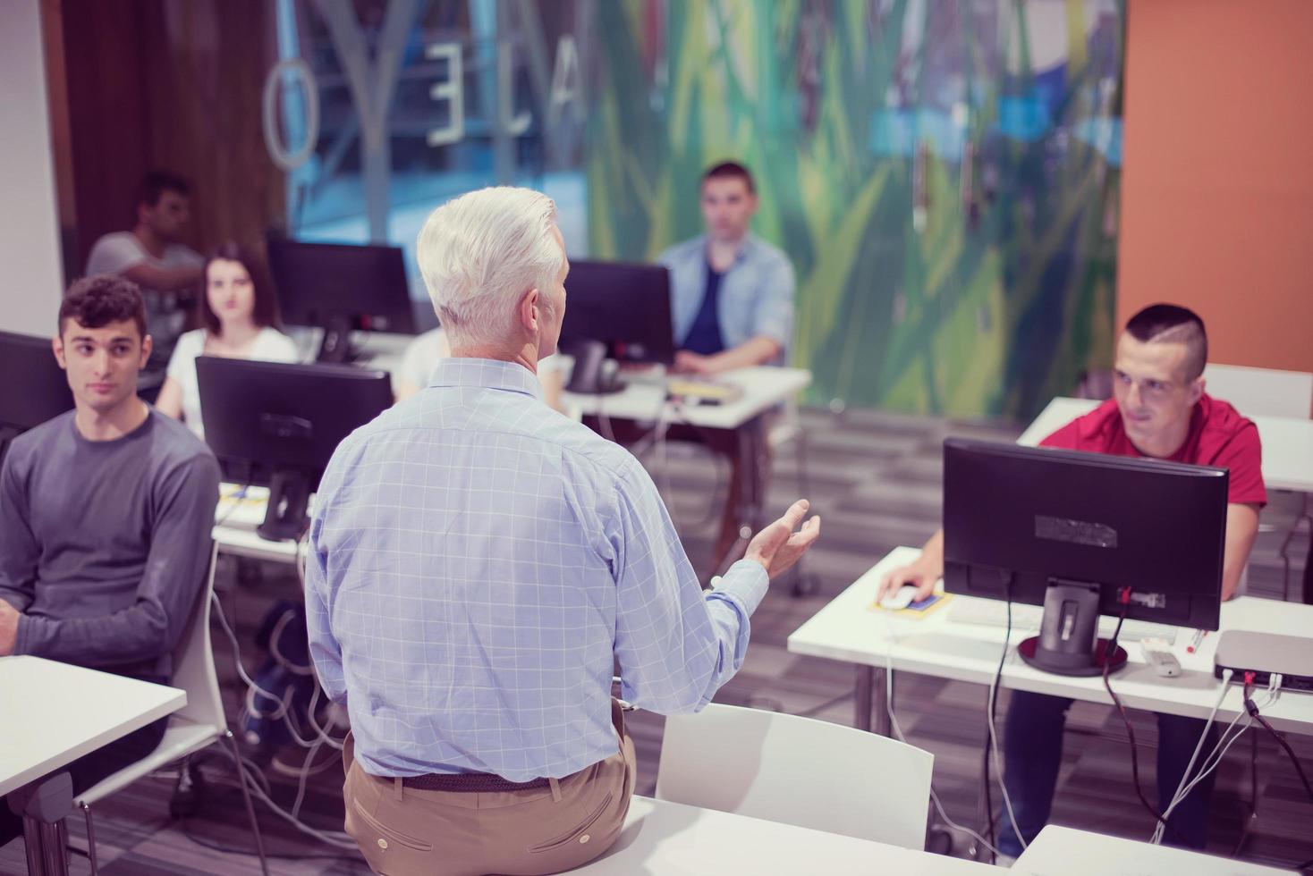 teacher and students in computer lab classroom photo