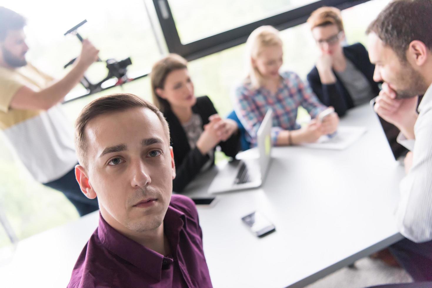 Group of young people meeting in startup office photo