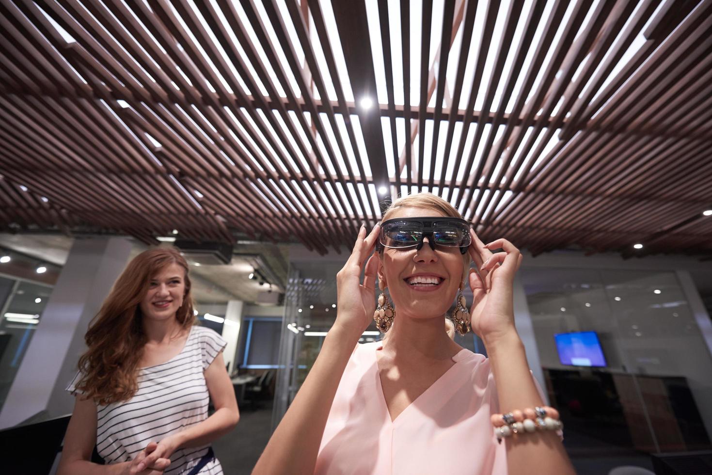 woman using virtual reality gadget computer glasses photo