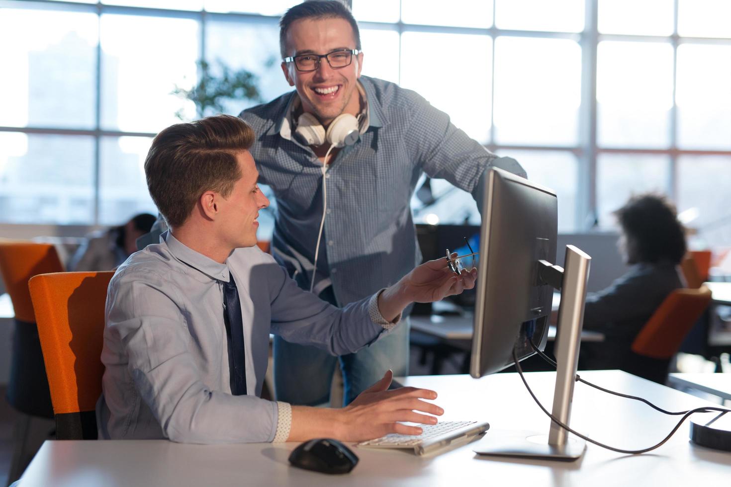 Two Business People Working With computer in office photo