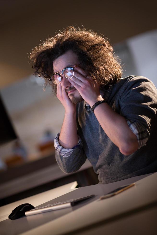 businessman relaxing at the desk photo