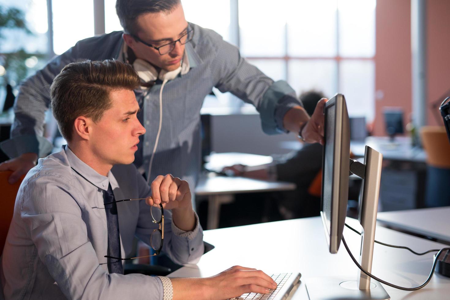 Two Business People Working With computer in office photo