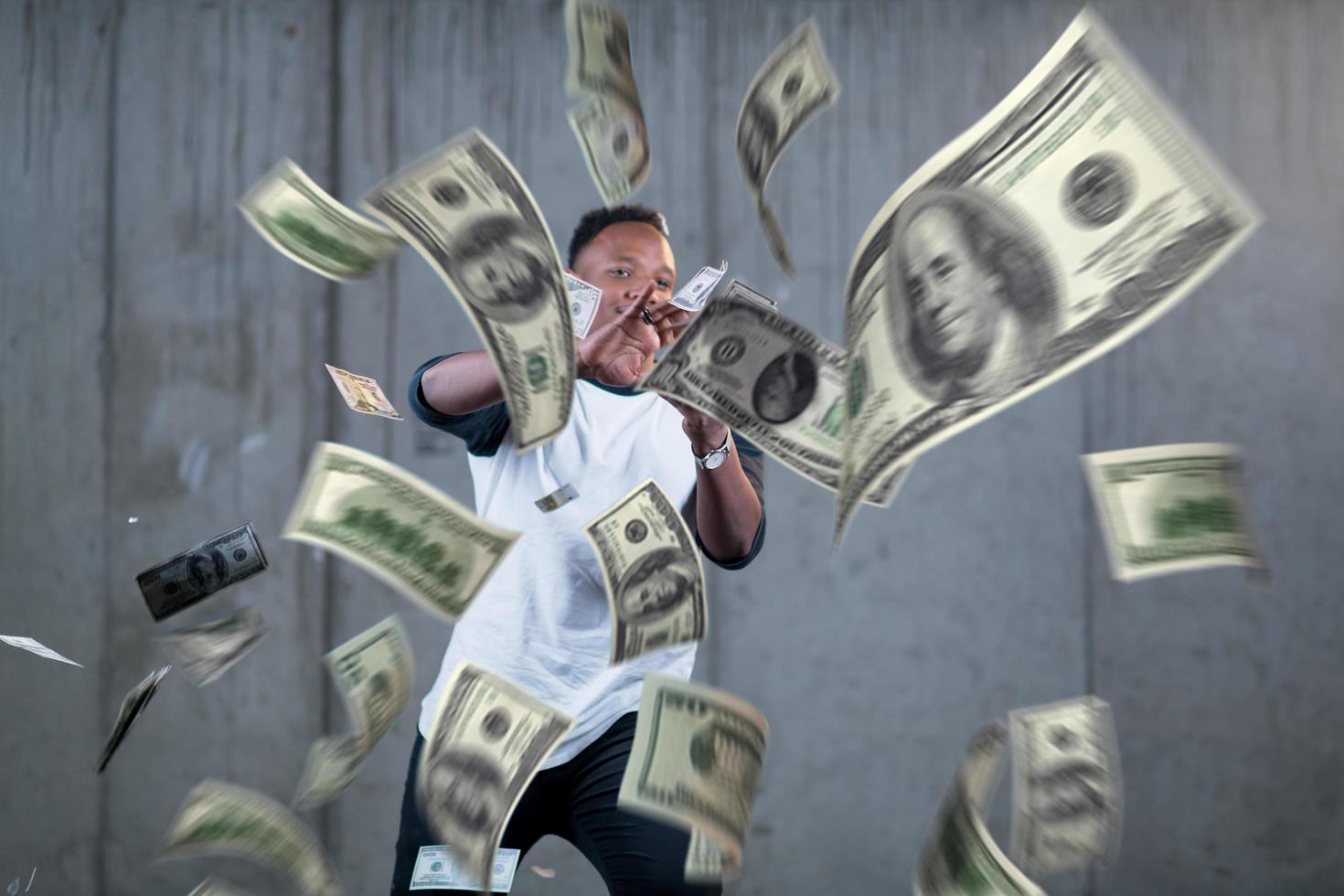 black businessman making the rain of money photo