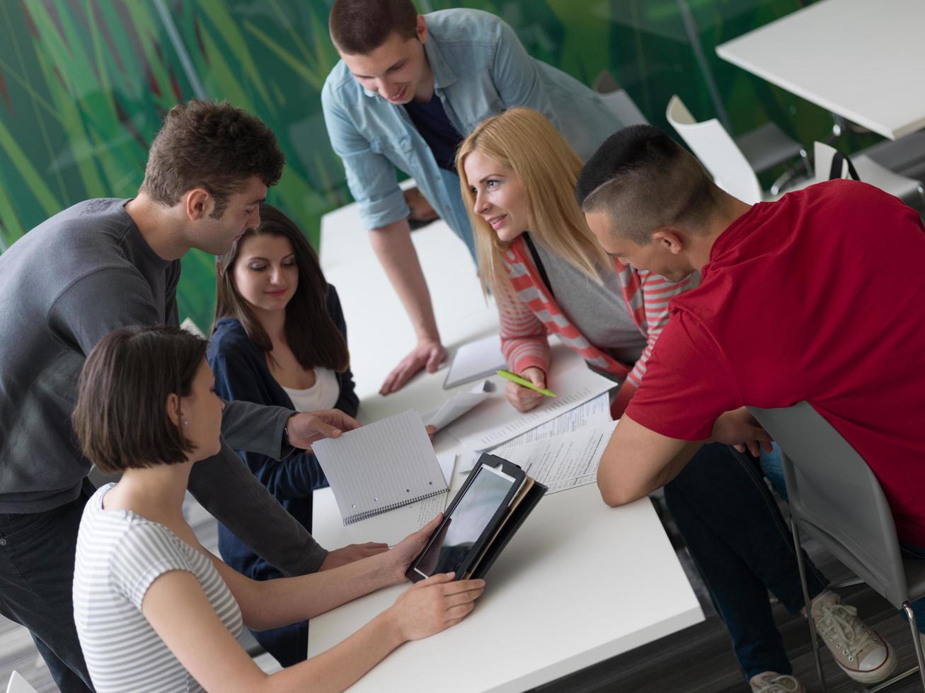 group of students study together in classroom photo