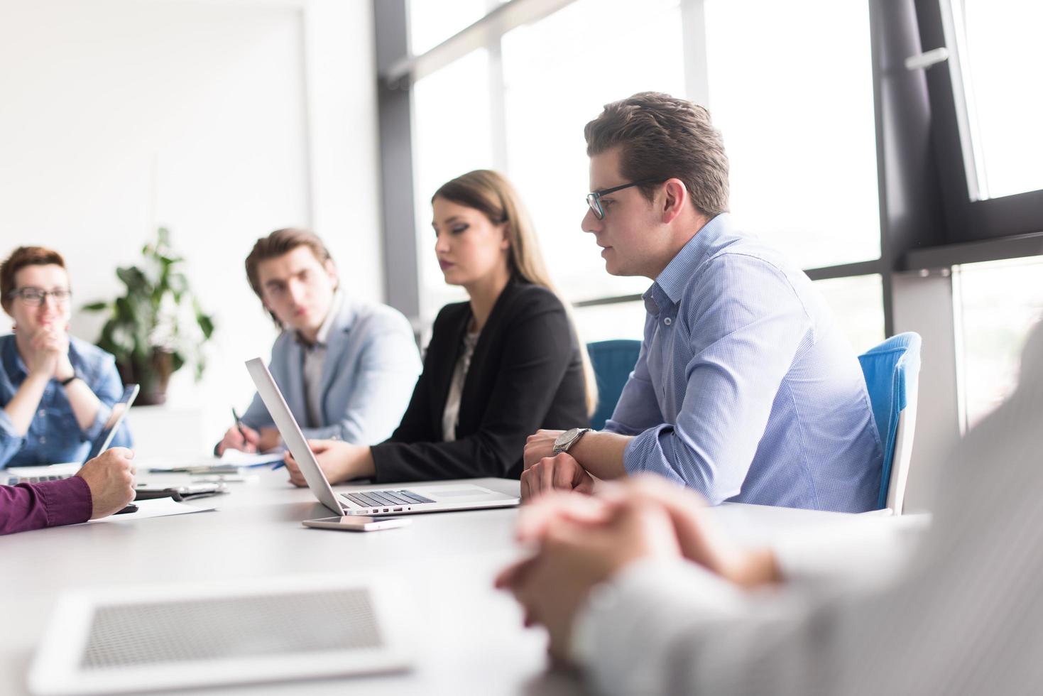 Business Team At A Meeting at modern office building photo