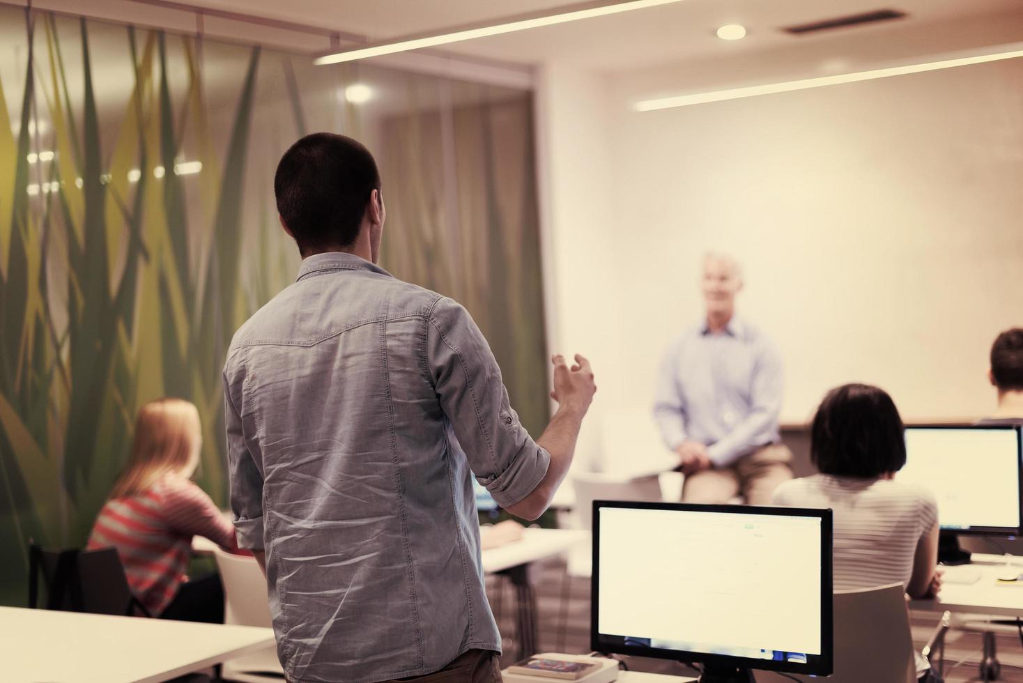 student answering a question in classroom photo