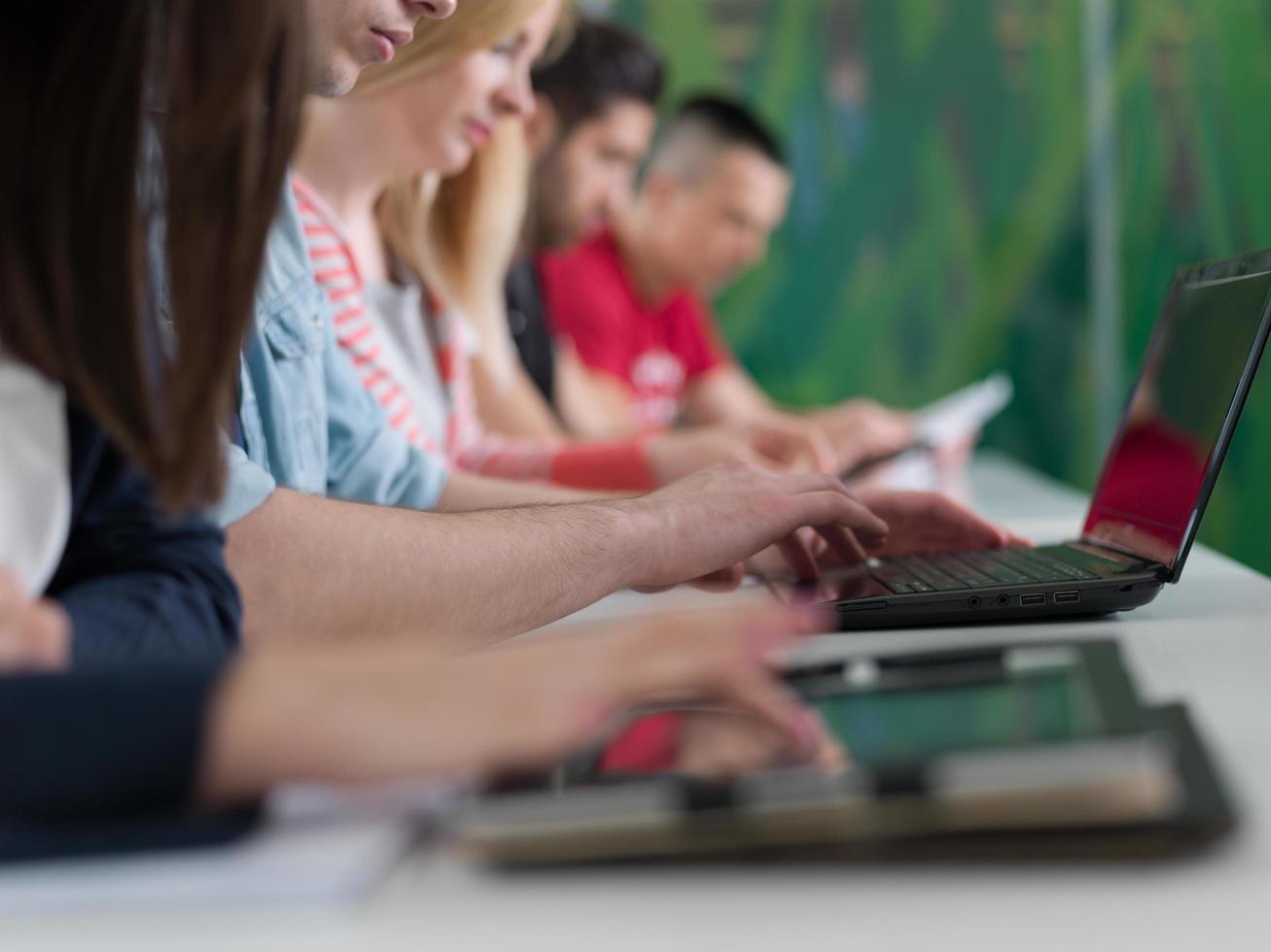 group of students study together in classroom photo