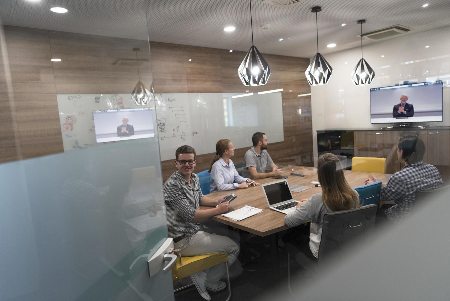 start up business people group attending videoconference call photo