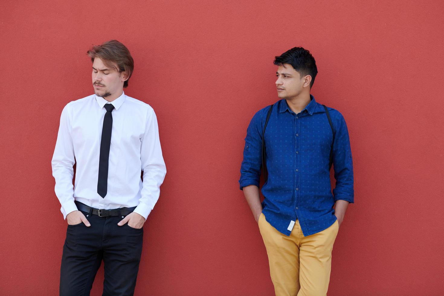 portrait of multiethnic startup business men in front of pink wall photo