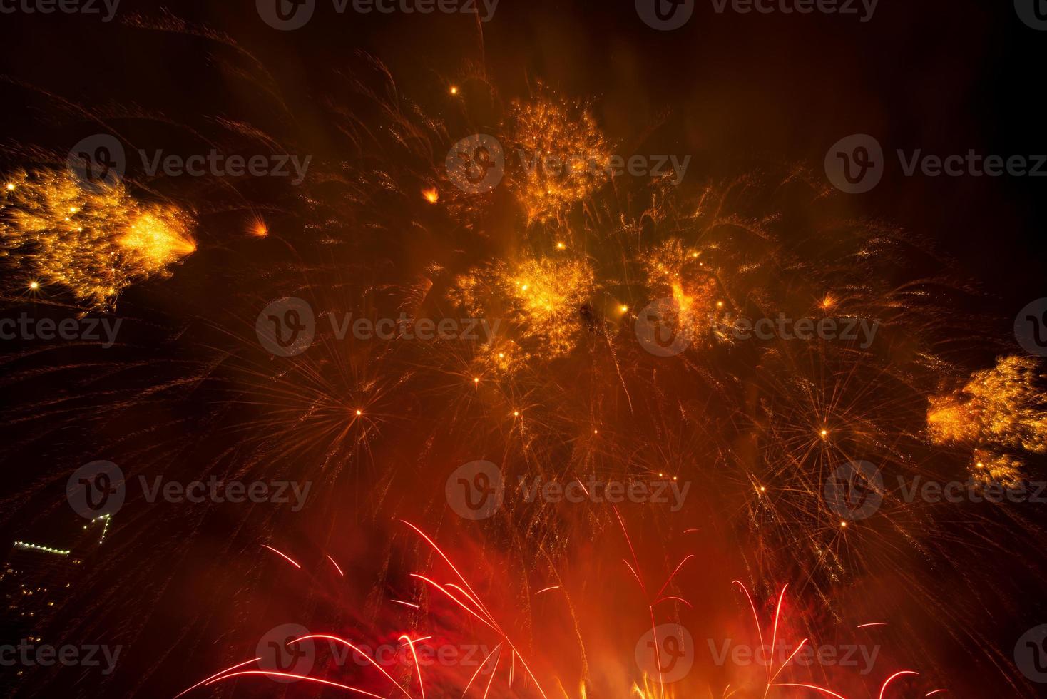 fireworks on the river in the dark sky photo