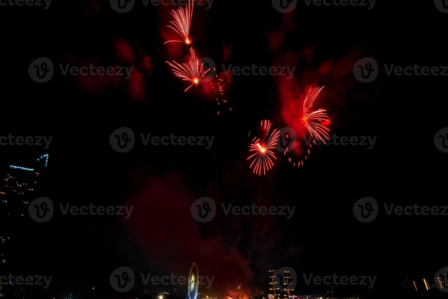 fireworks on the river in the dark sky photo