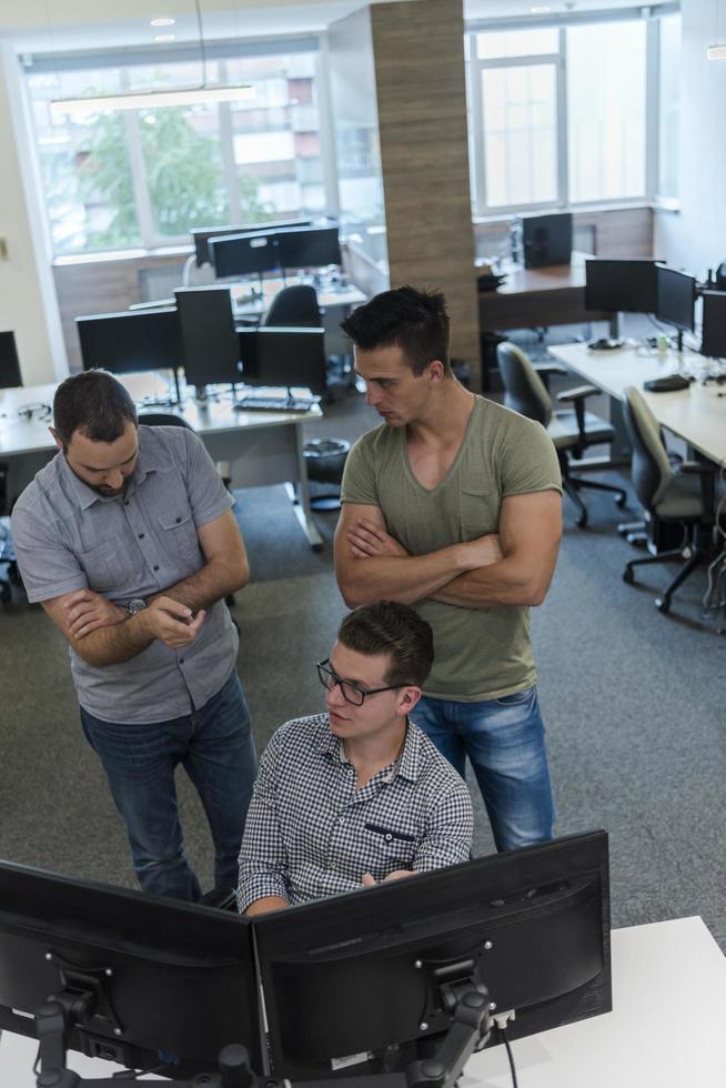 startup business people group working as team to find solution photo