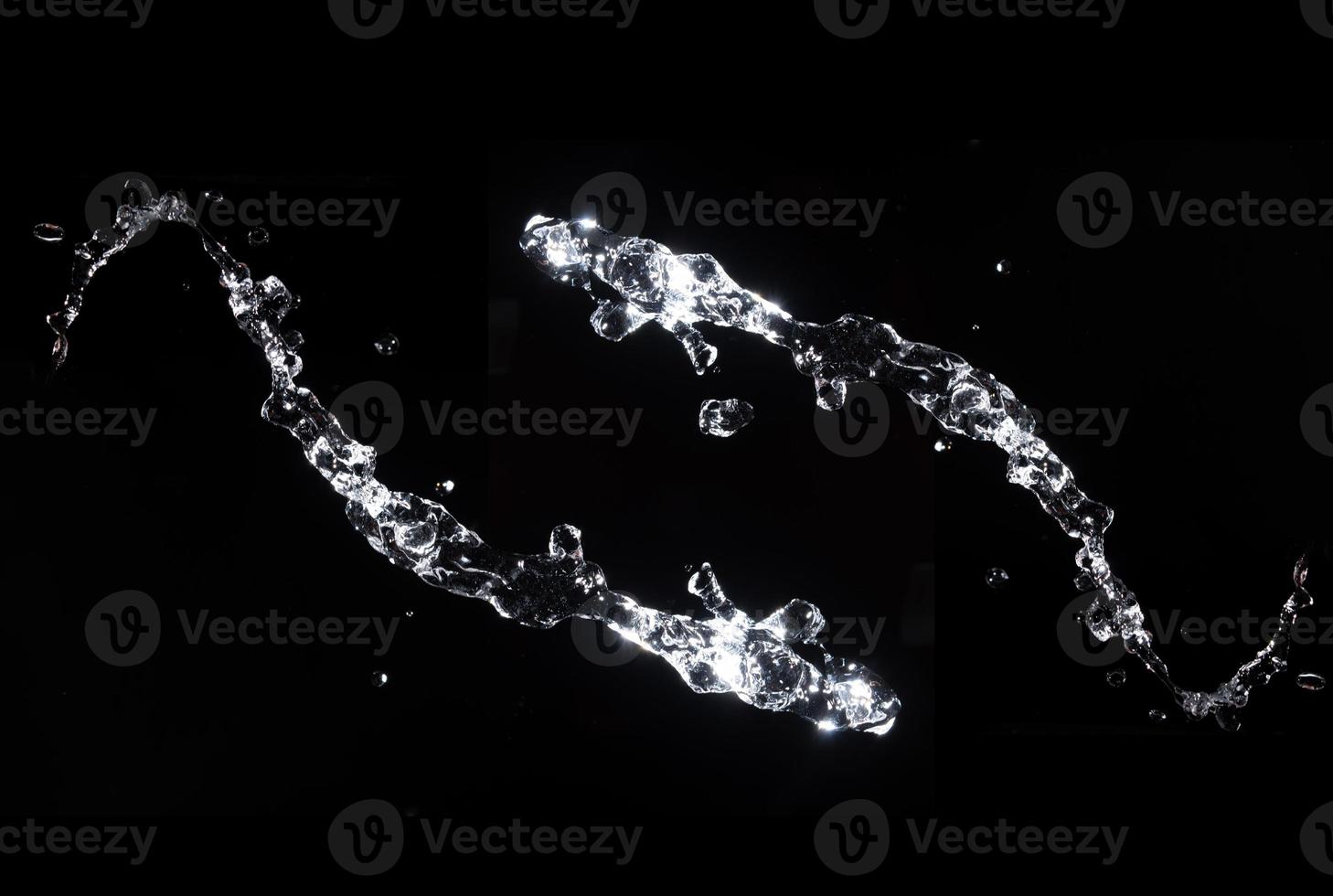 Water splash shot in studio, white water and black background, pure water for drink and food concept copy space for text and design photo