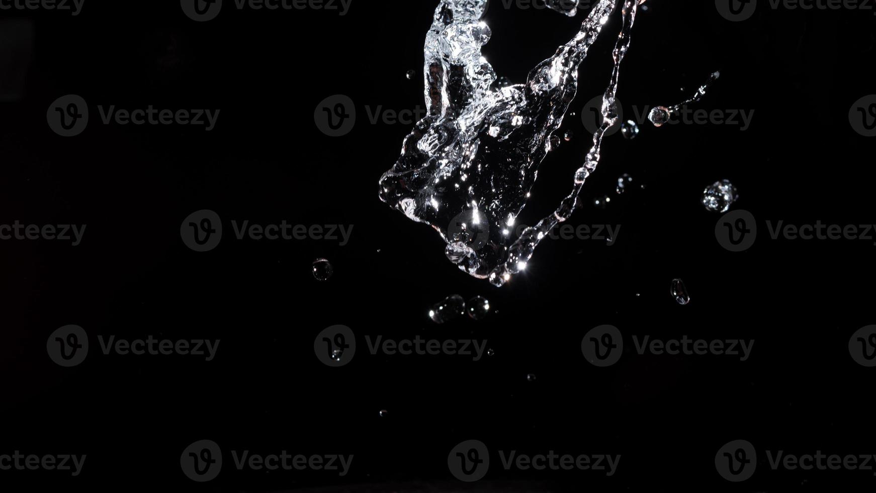 Water splash shot in studio, white water and black background, pure water for drink and food concept copy space for text and desig photo
