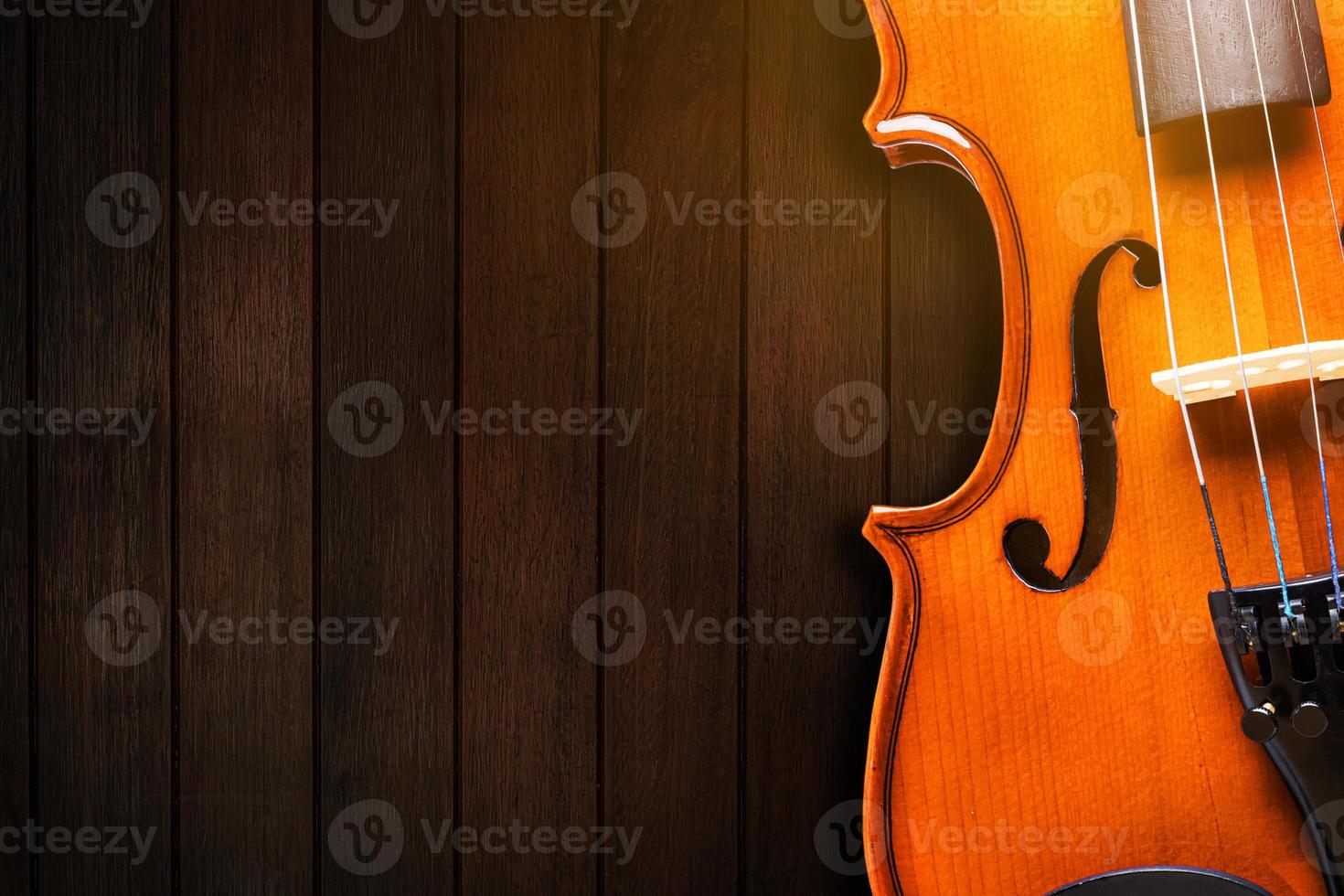 Musical instrument, violin Classical instrument on wooden background. photo