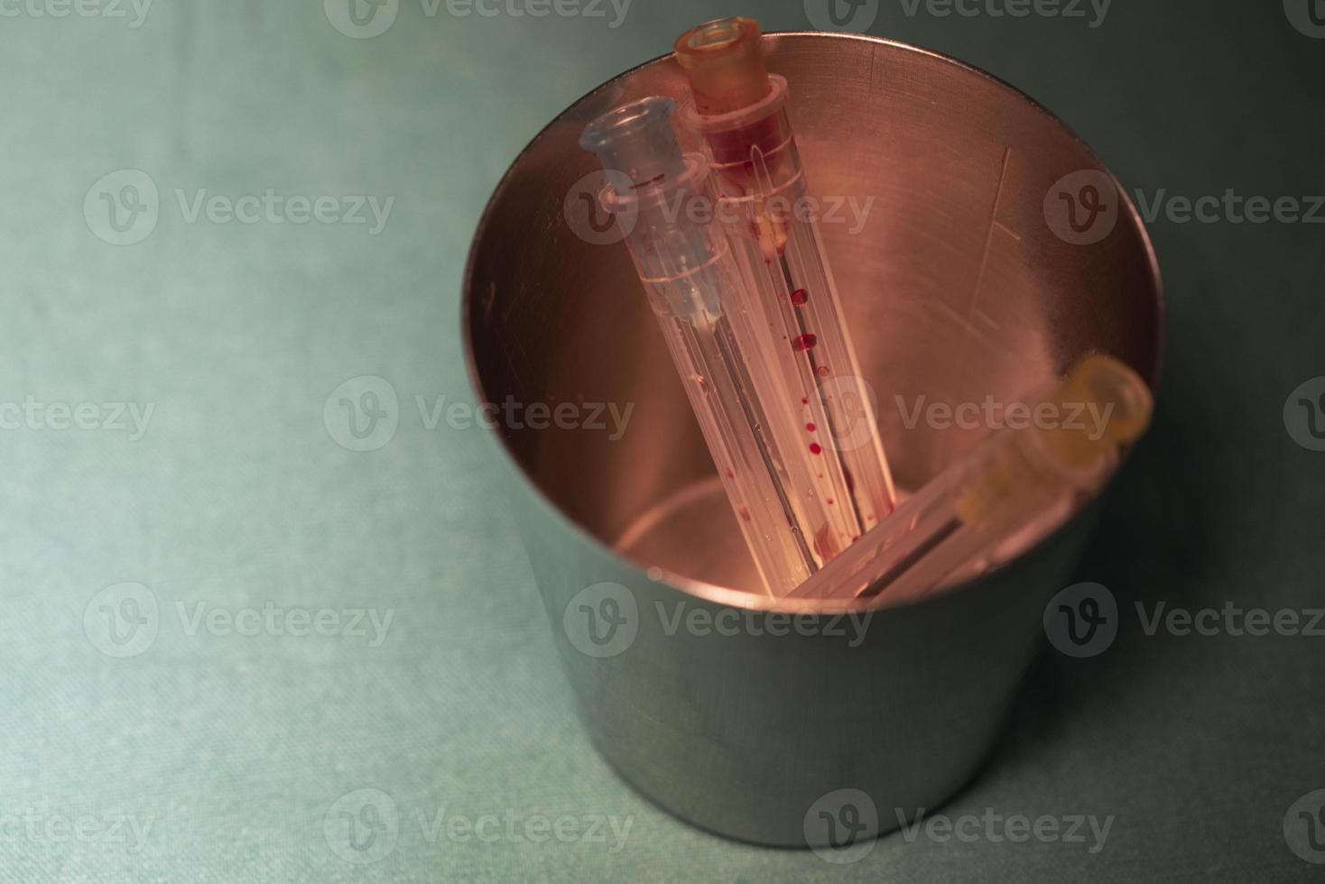 Use surgical needles in a cup photo