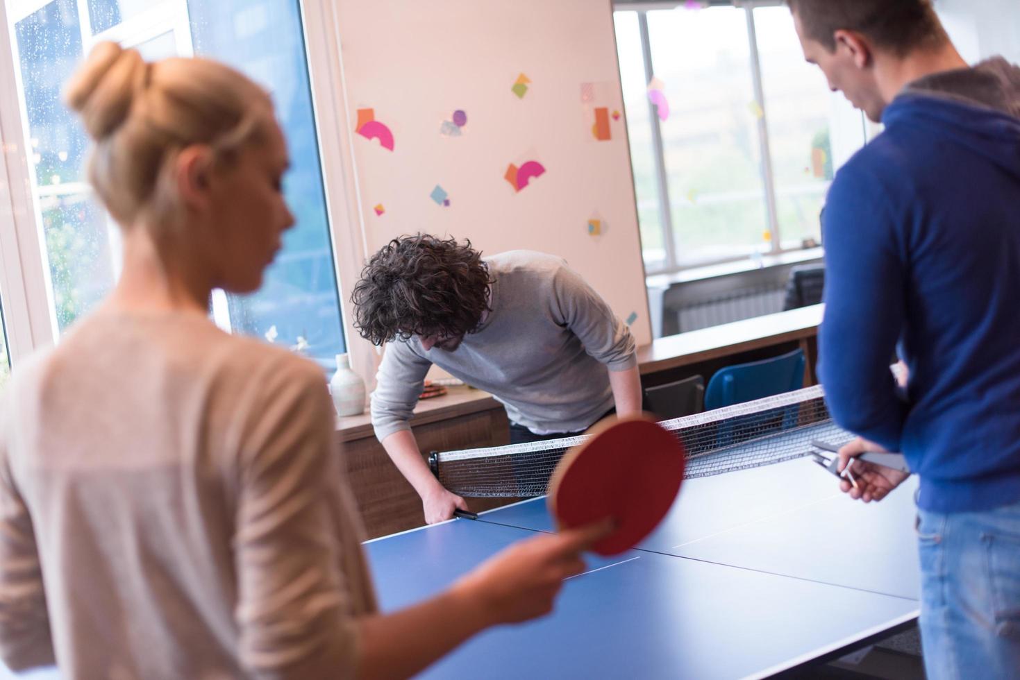 startup business team playing ping pong tennis photo