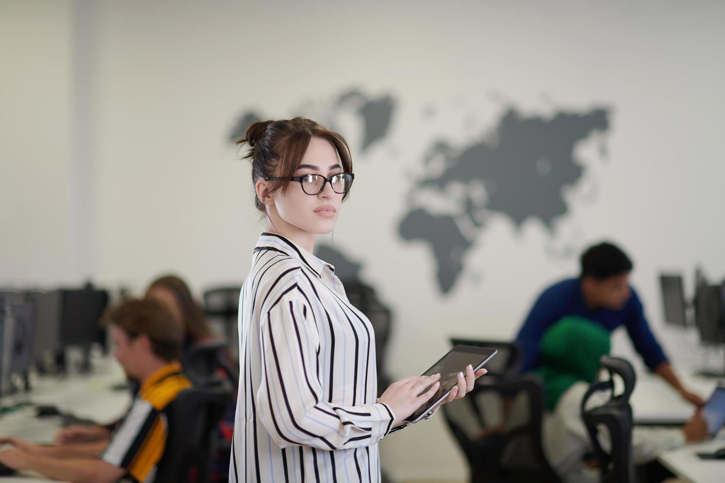 portrait of businesswoman holding tablet computer photo