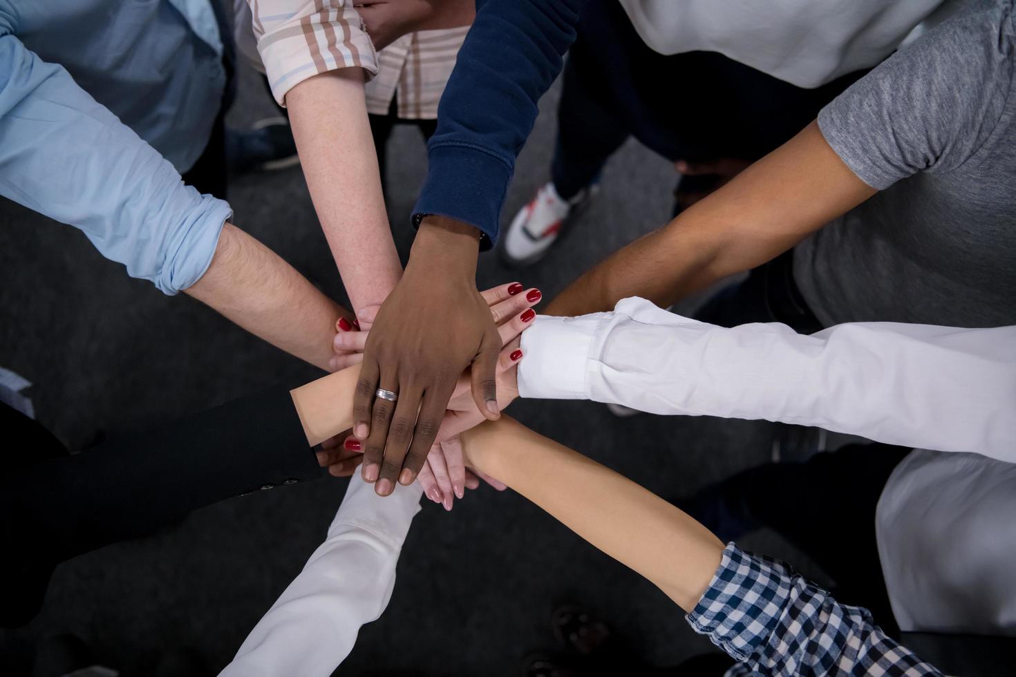 multiethnic Group of young business people celebrating success photo