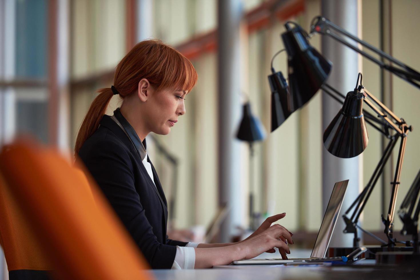 business woman working on computer at office photo