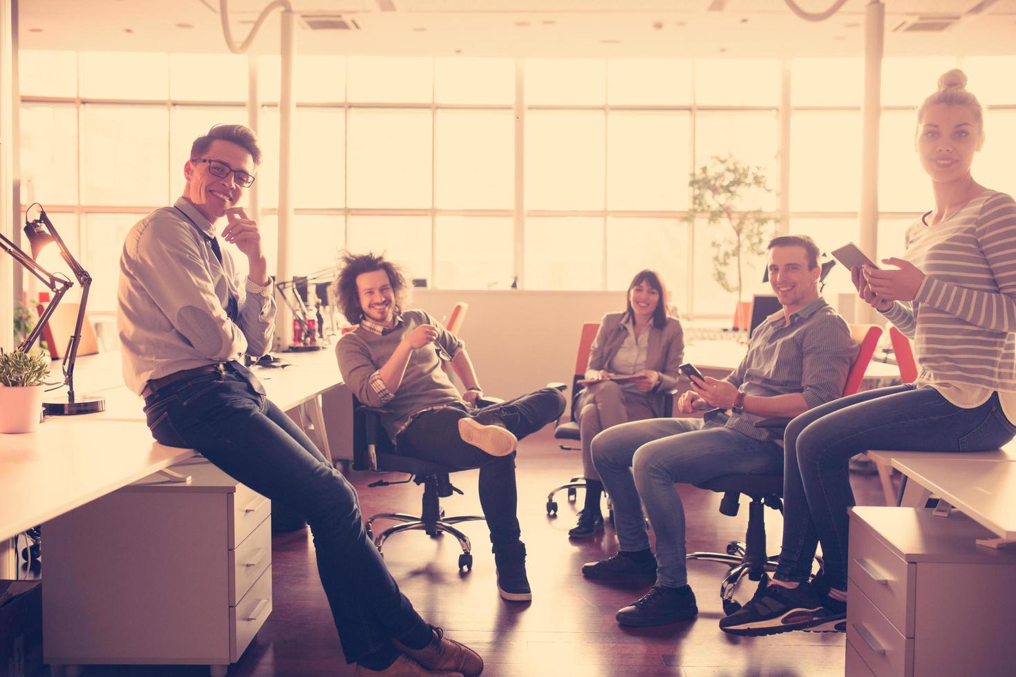 Young Business Team At A Meeting at modern office building photo