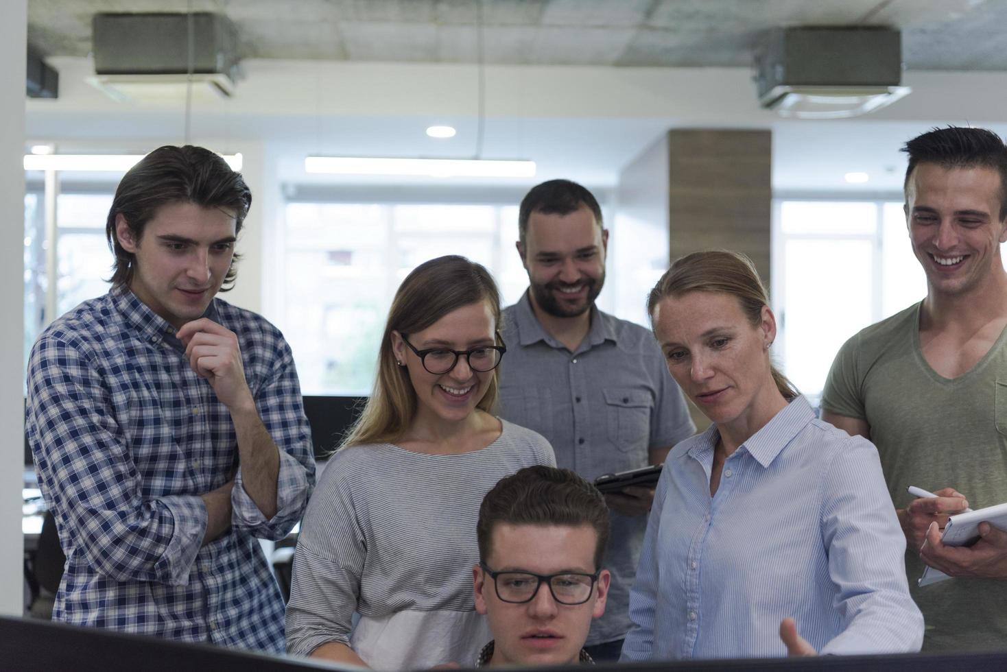 startup business people group working as team to find solution photo