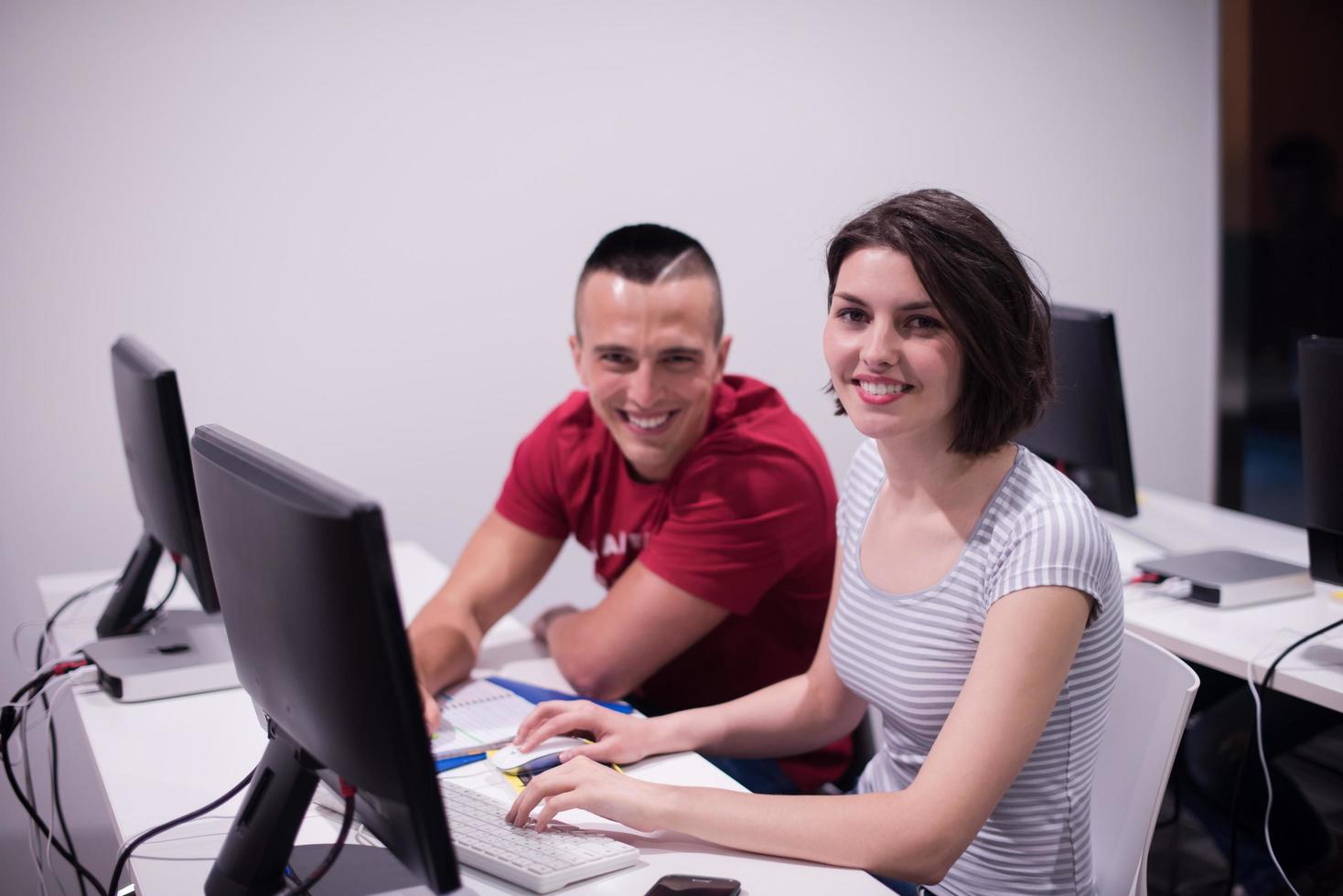 technology students group working  in computer lab school  classroom photo