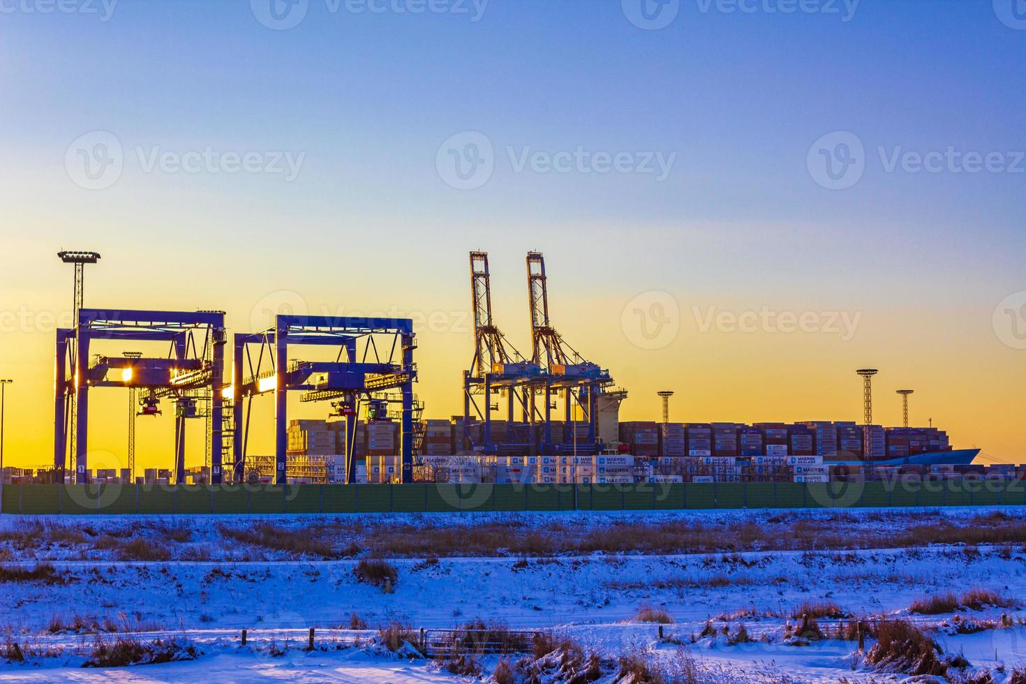 Shipyard cranes shipyard crane sunset winter container port Bremerhaven Germany. photo