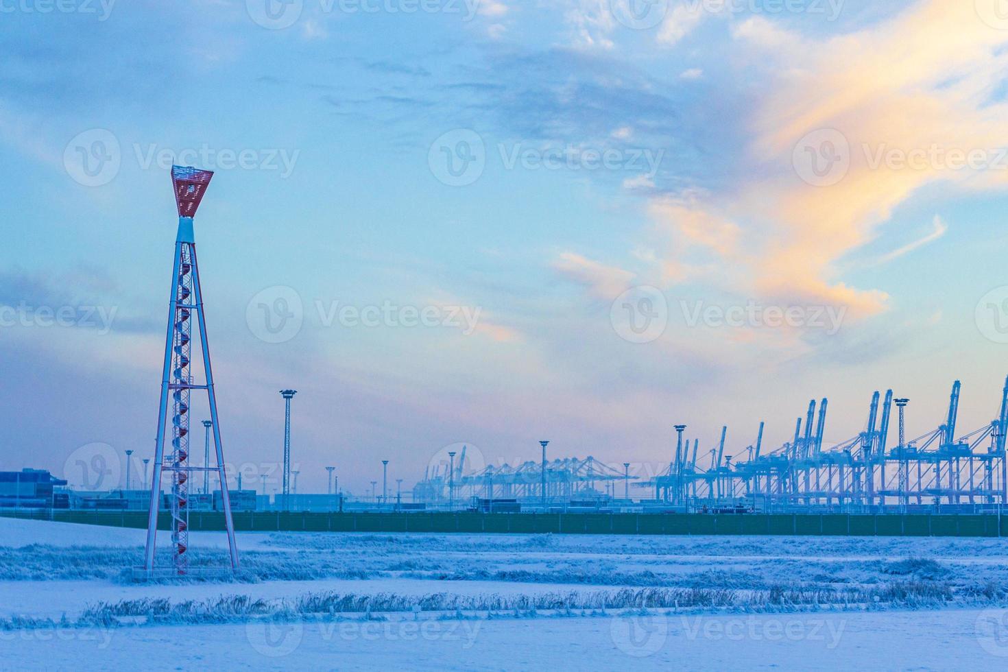 Shipyard cranes shipyard crane sunset winter container port Bremerhaven Germany. photo