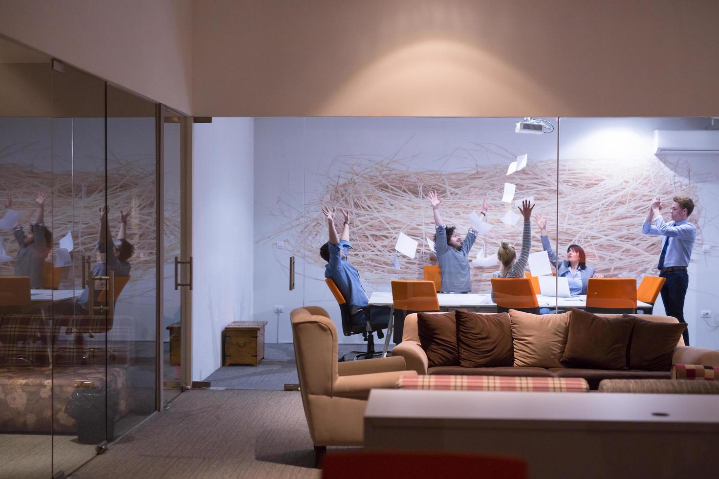 Group of young business people throwing documents photo