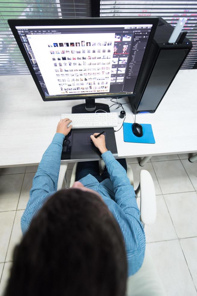 photo editor at his desk