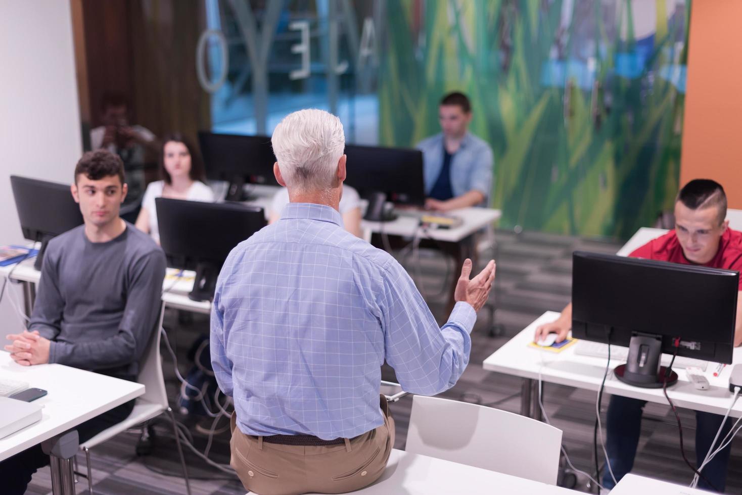 teacher and students in computer lab classroom photo