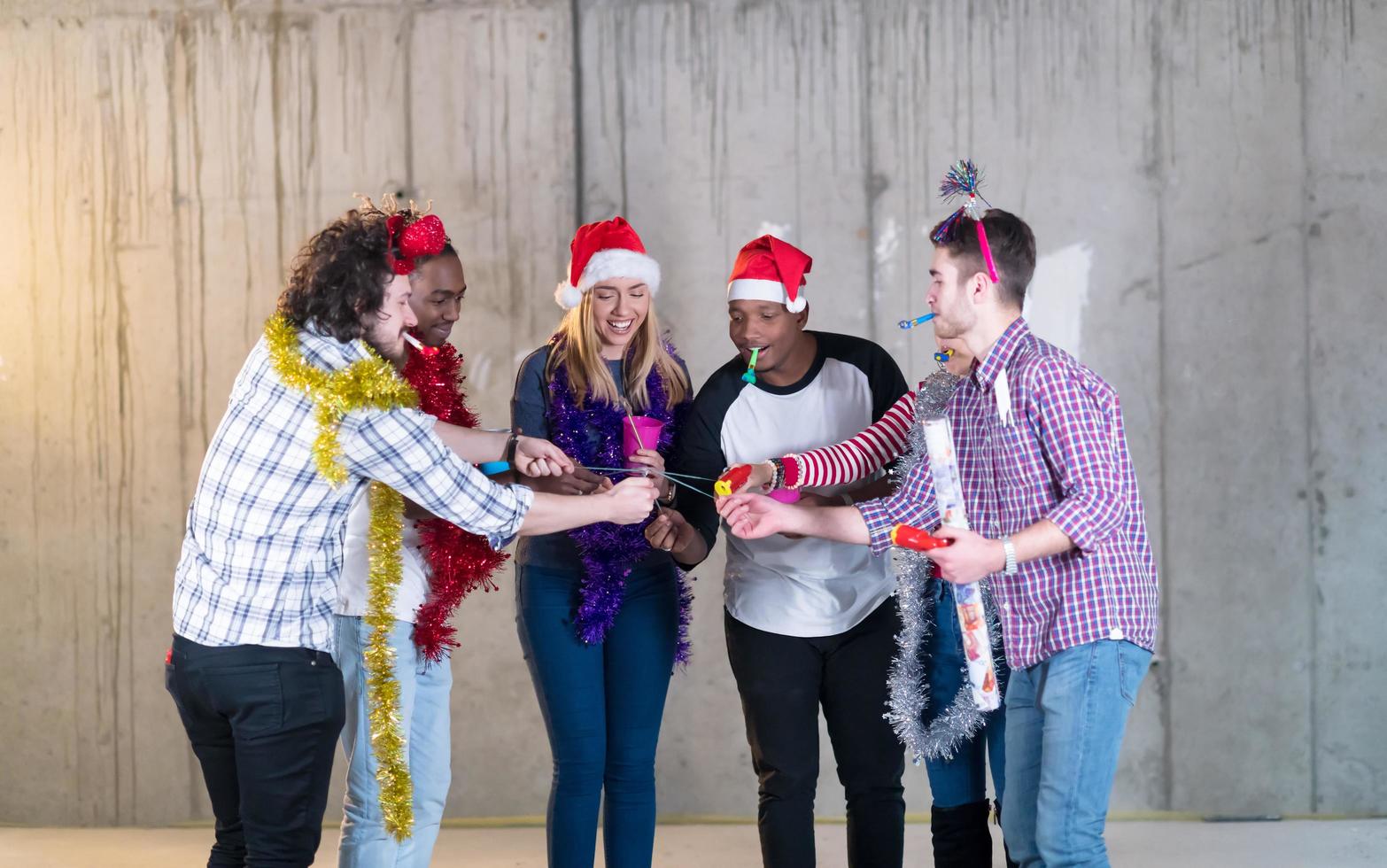 multiethnic group of casual business people lighting a sparkler photo