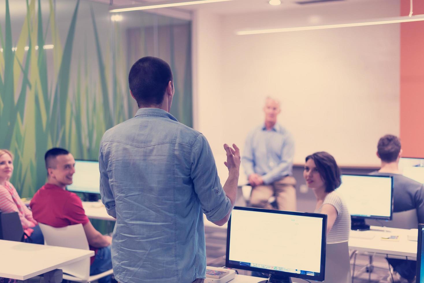 student answering a question in classroom photo