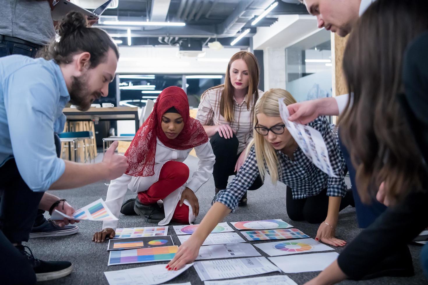 black muslim woman having meeting with Multiethnic  startup business team photo