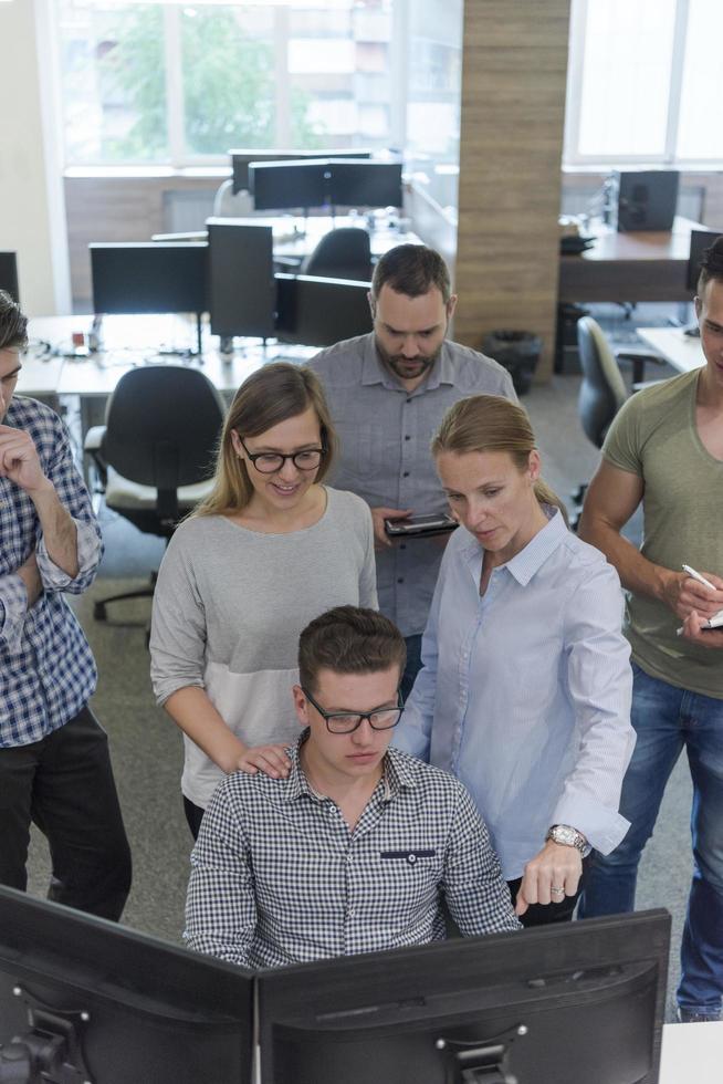 startup business people group working as team to find solution photo