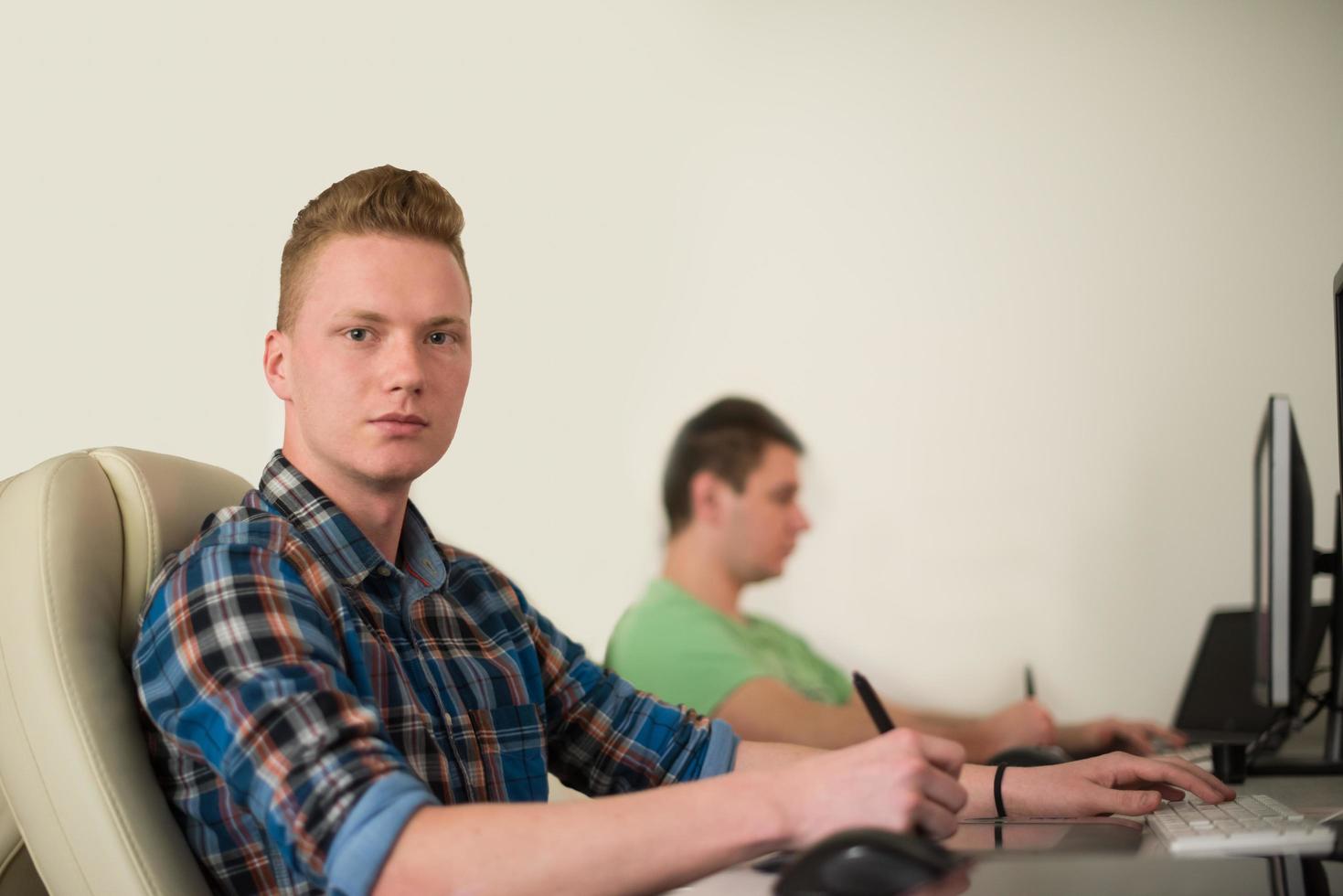 a group of graphic designers at work photo