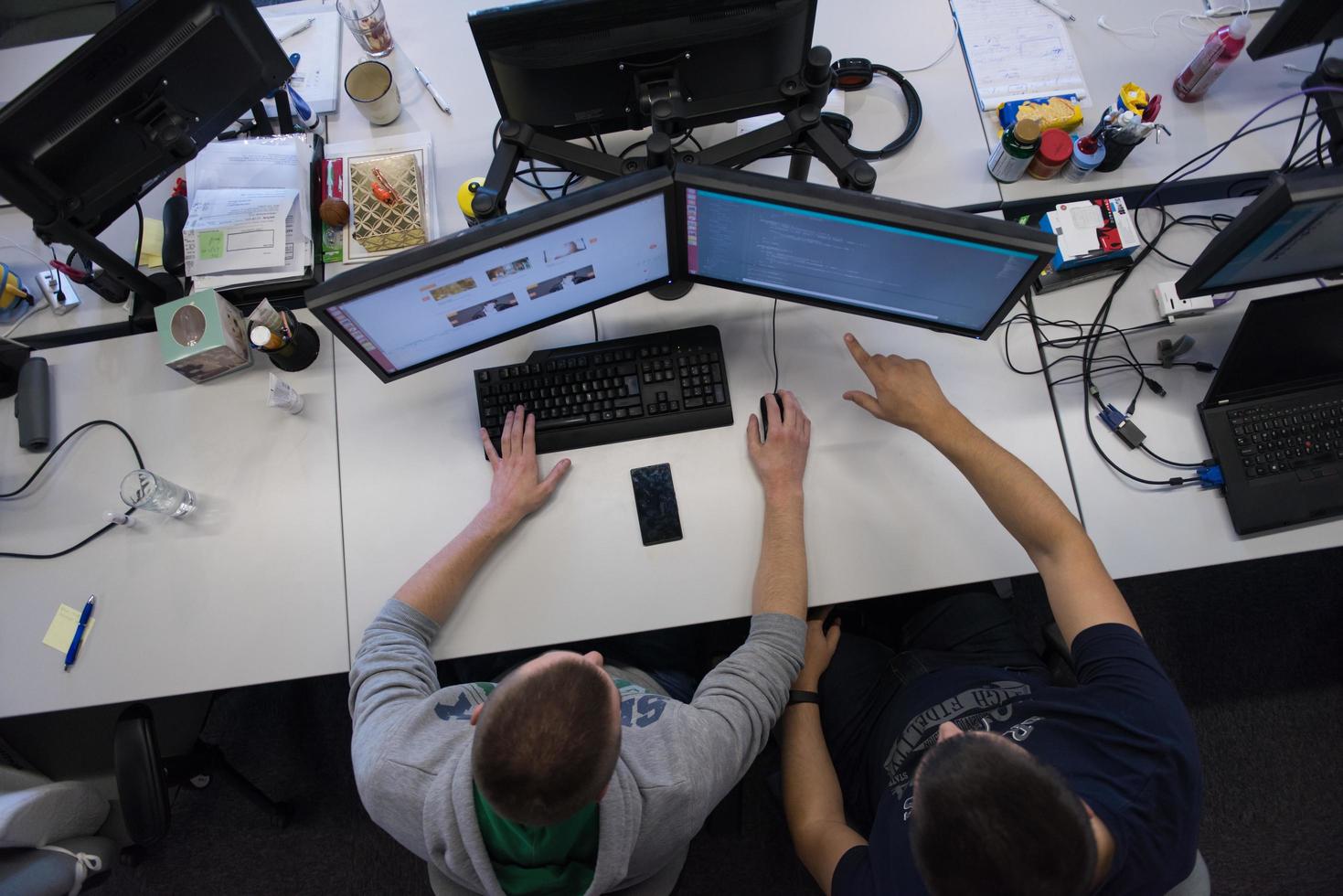 young programmers writing programming code top view photo