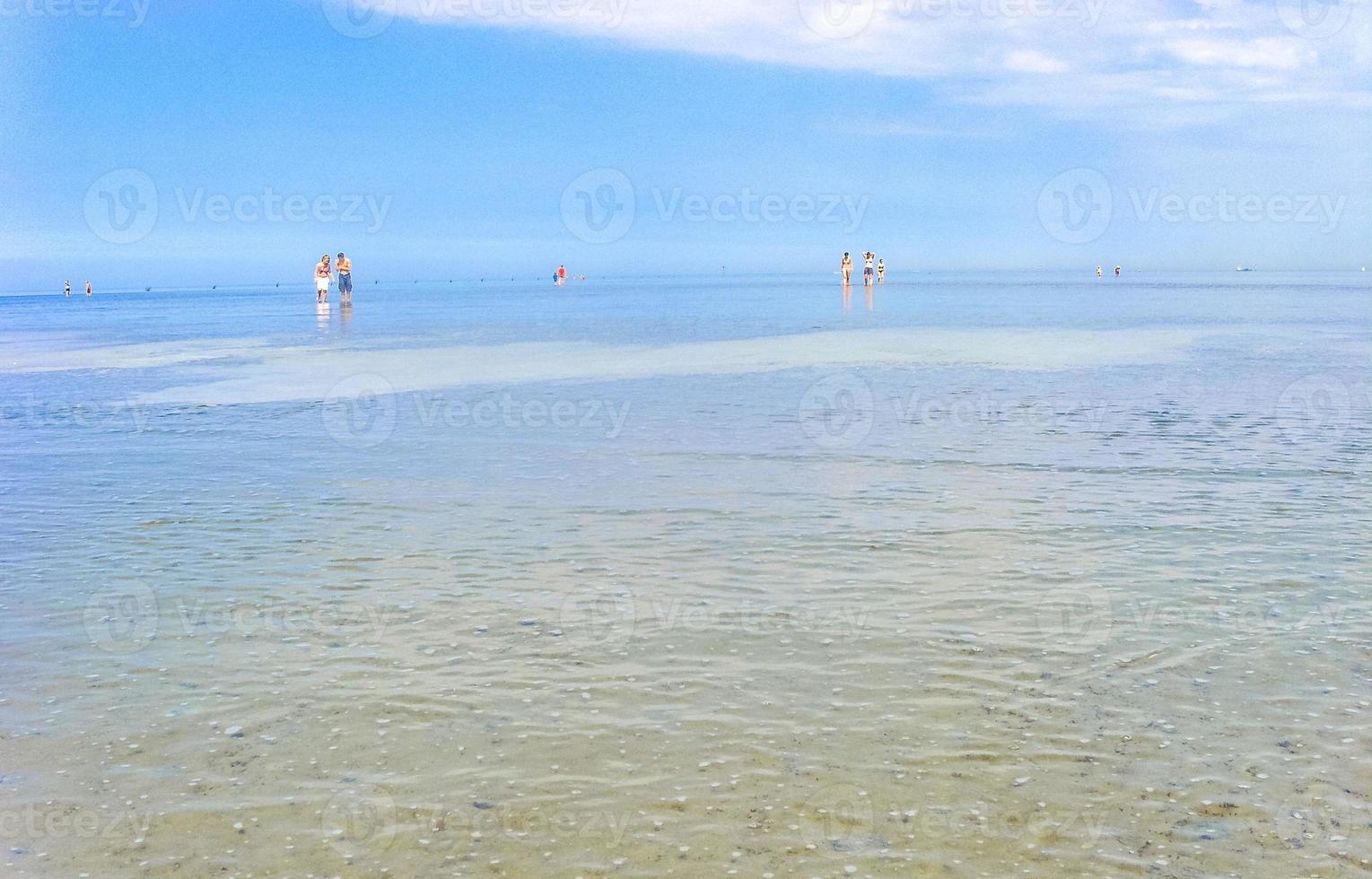 Seascape beach mudflats hiking on the North Sea coast Germany. photo