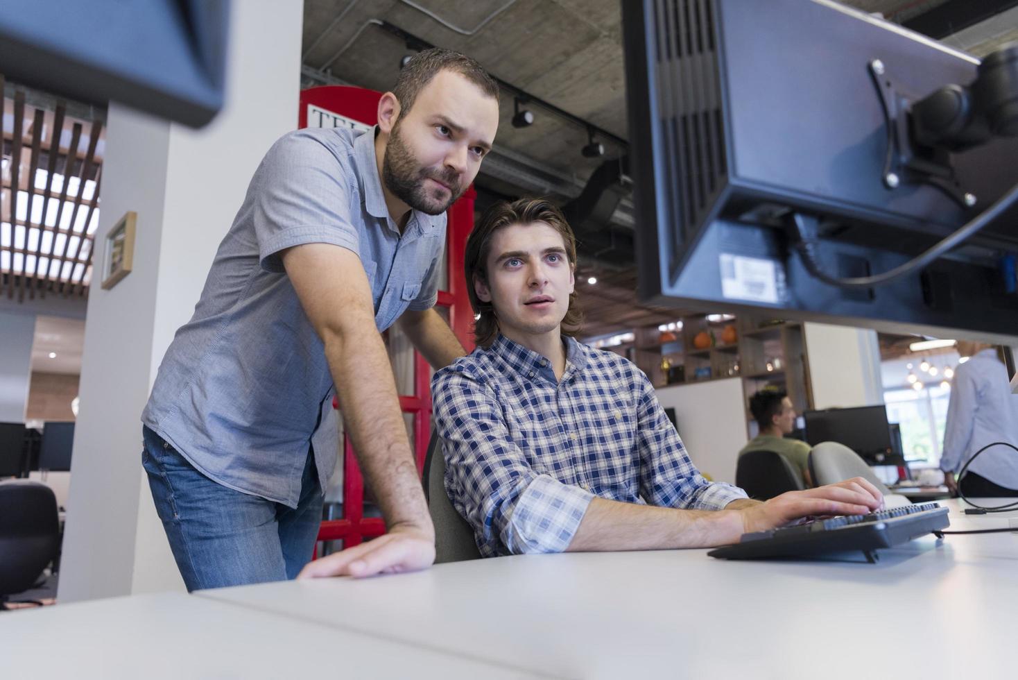 startup business people group working as team to find solution photo