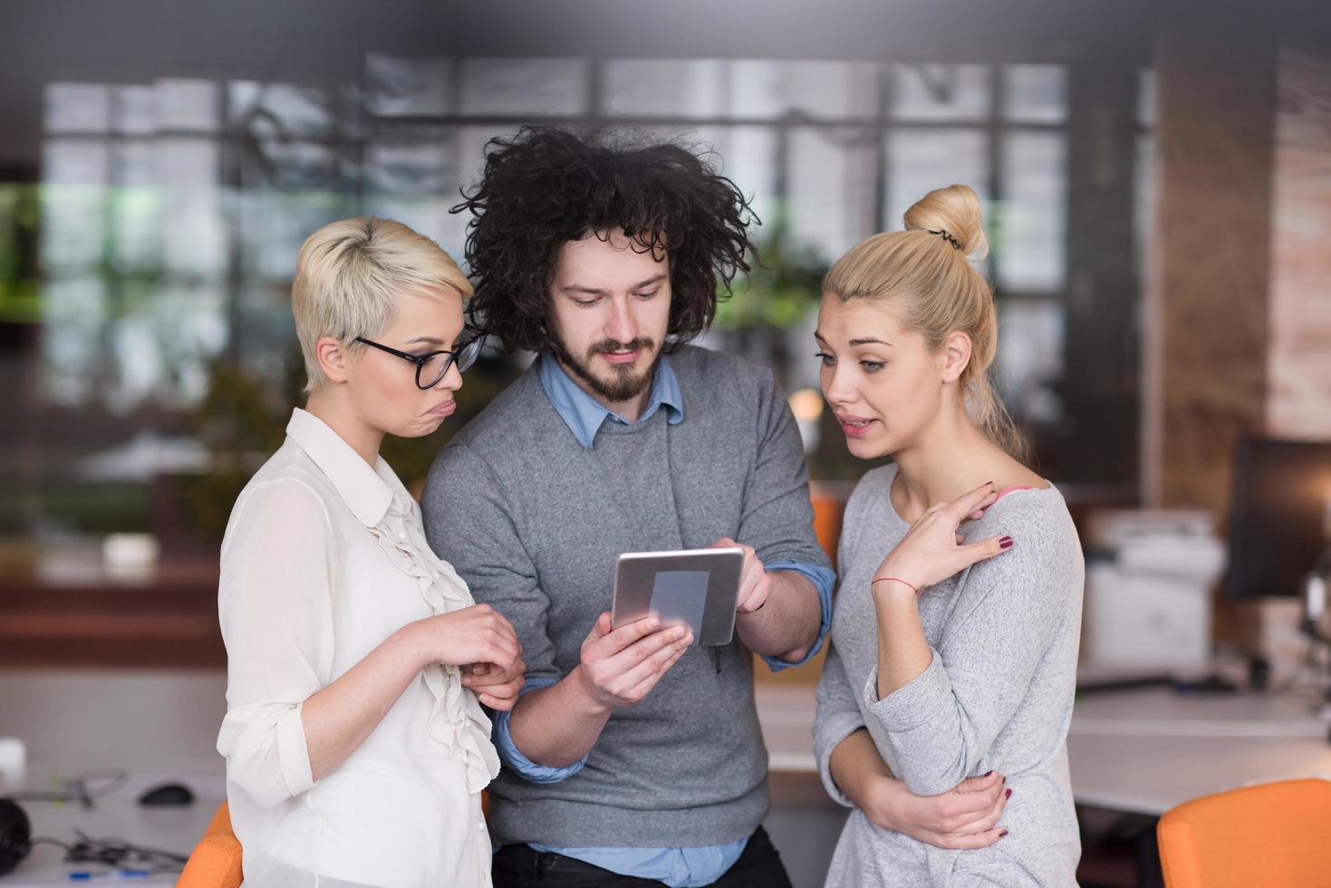 group of Business People Working With Tablet in startup office photo