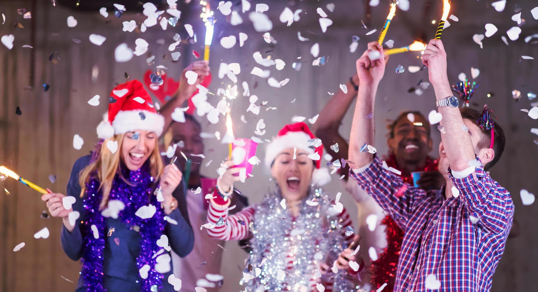 multiethnic group of casual business people having confetti party photo